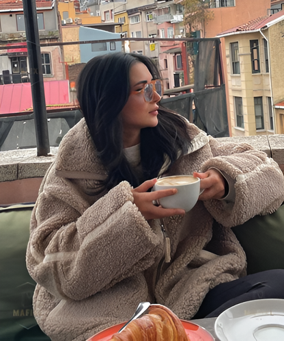 Manteau fausse fourrure femme effet teddy oversize à revers