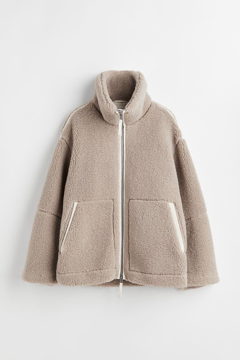 Manteau fausse fourrure femme effet teddy oversize à revers
