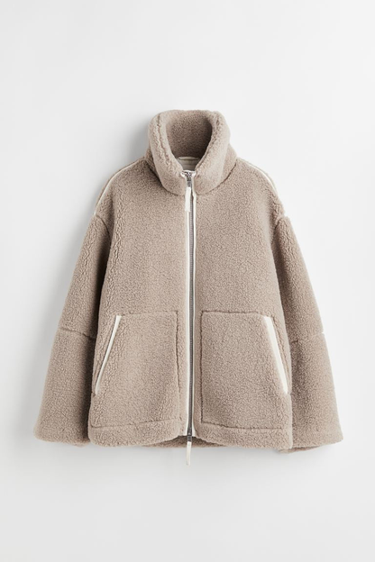 Manteau fausse fourrure femme effet teddy oversize à revers
